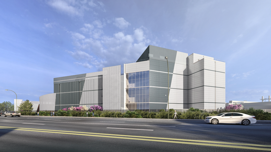Rendering of a modern manufacturing and utility building with trees and shrub landscape, in front of a street.